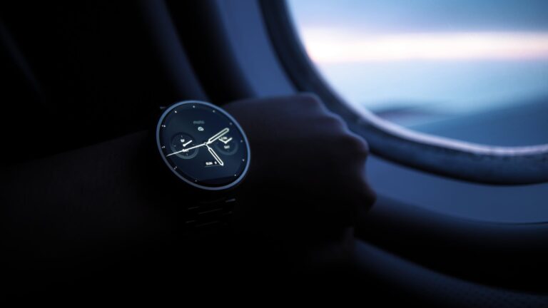 person wearing analog watch