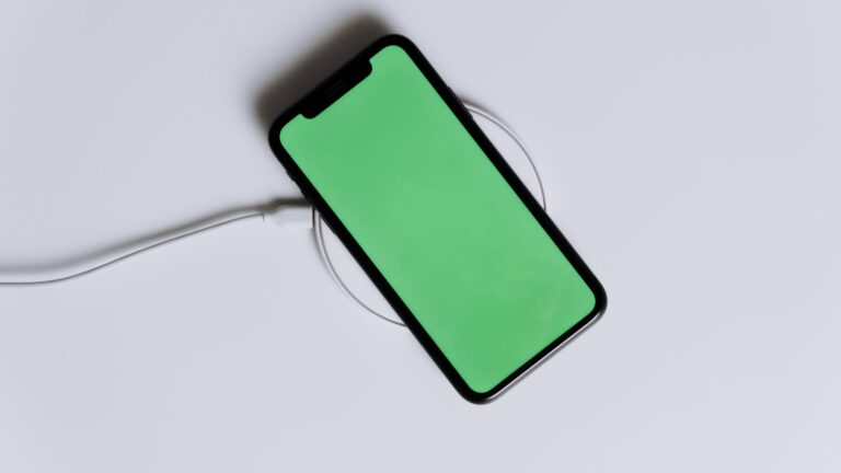 green iphone case on white surface