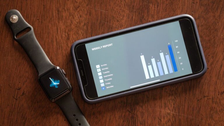 a smartphone and smartwatch on the table