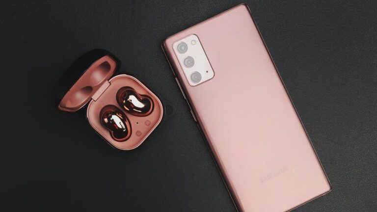 android smartphone next to a wireless earphone