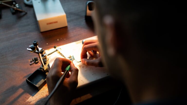 mechanical engineer soldering in workshop
