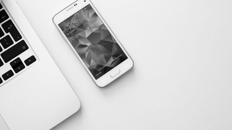 high angle shot of laptop and smartphone