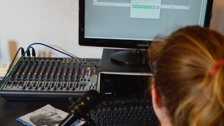unrecognizable sound engineer installing software on desktop computer at home
