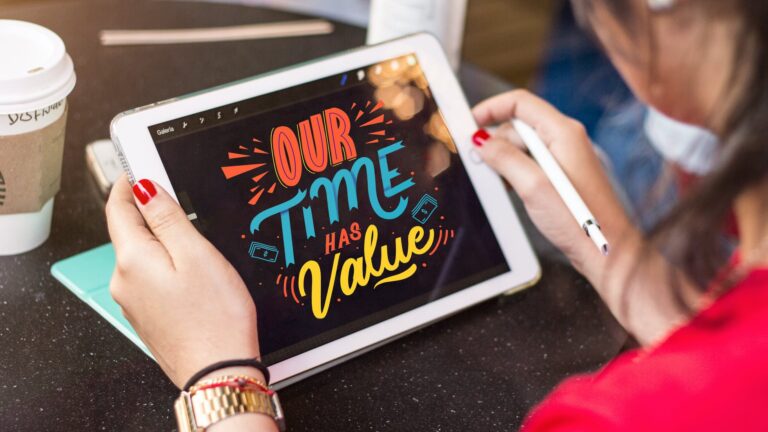 woman holding silver ipad