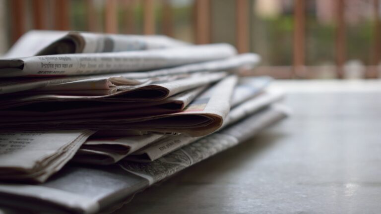 selective focus photography of magazines